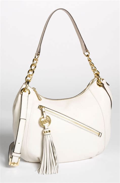 michael kors charm tassel bag|are Michael Kors purses leather.